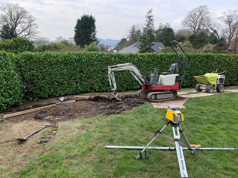 JH Landscaping & in Kendal and Lake District gardening services patio building with digger and leveler