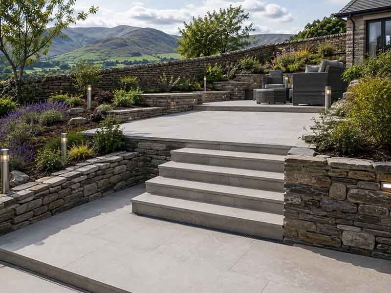 porcelain patio installation in a sloping South Lakes garden
